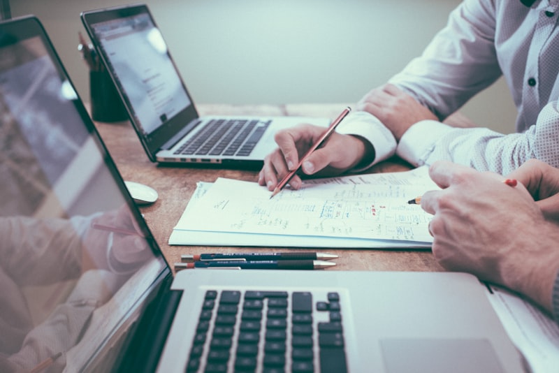 Business consultant analyzing financial reports and data