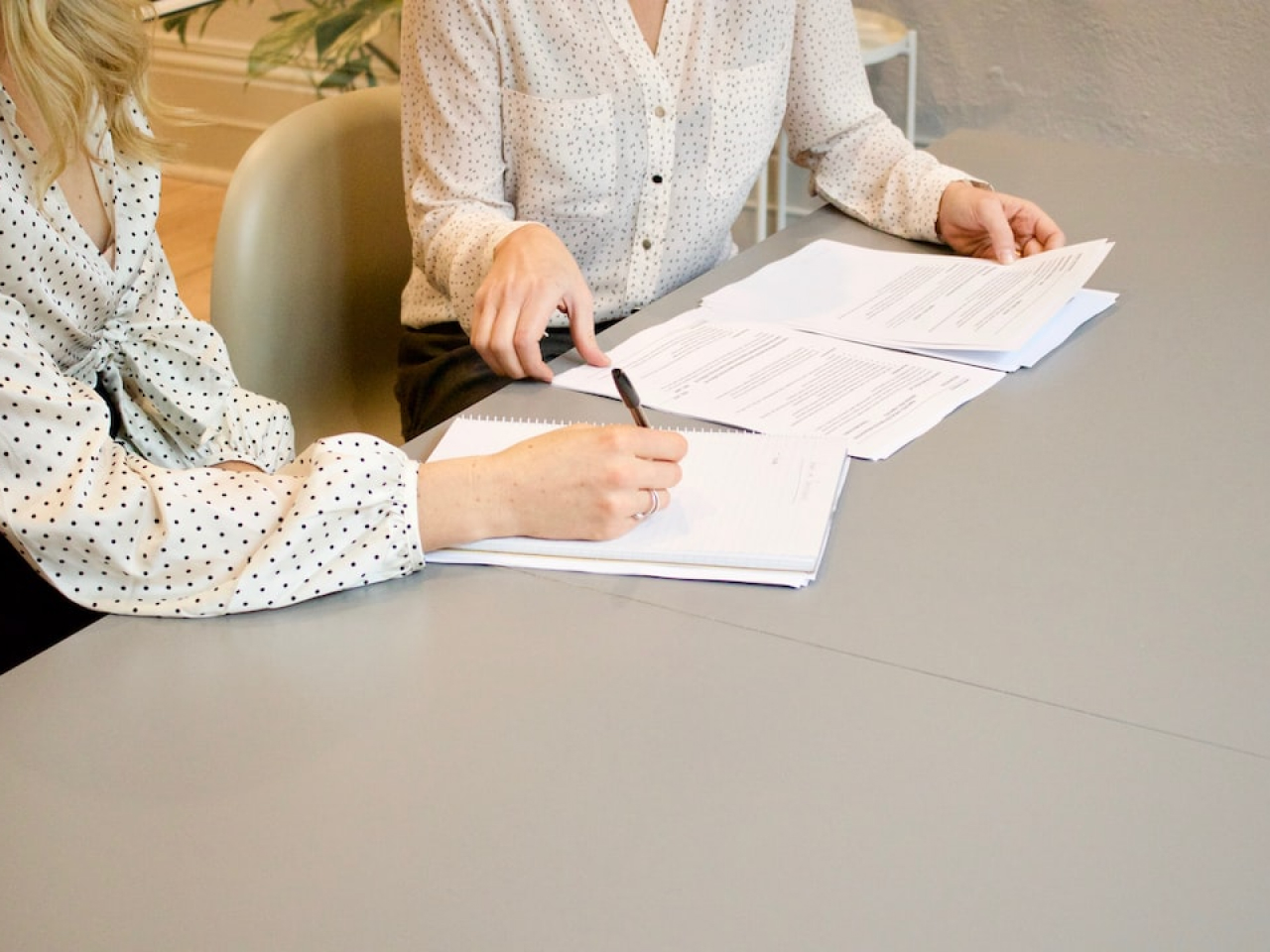 Business owner consulting with HR specialist about personnel documents